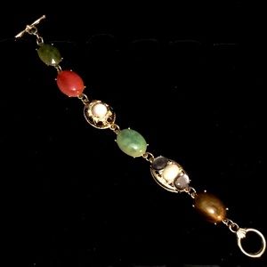 Gold plated and Multi colored stone link bracelet.